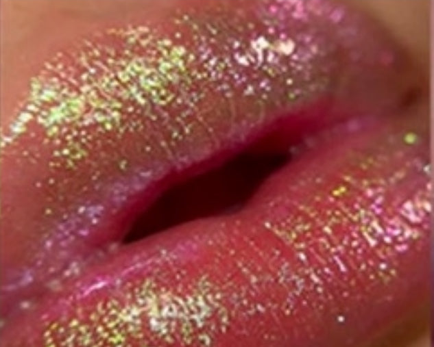 Close-up of pink lips covered in glitter.
